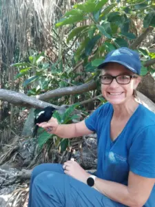Photo of Danielle holding a bird